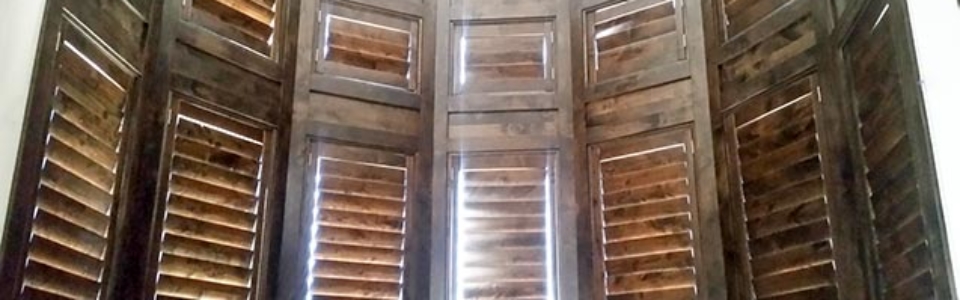 Custom Alder shutters on round window